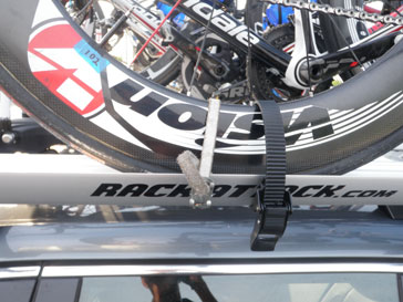 Bike wheel strapped to bike rack