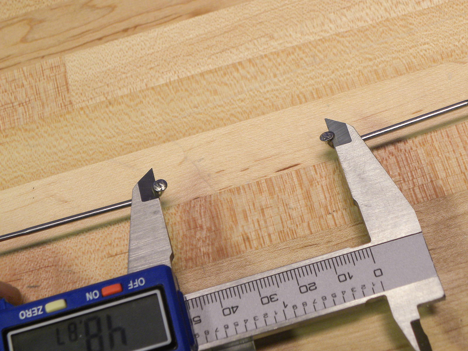 Measure from J-bend to J-bend using calipers, keeping caliper parallel to spokes