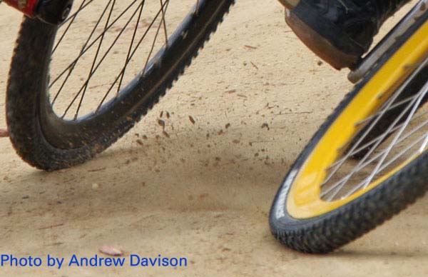 Close up of bike wheels in dirt track