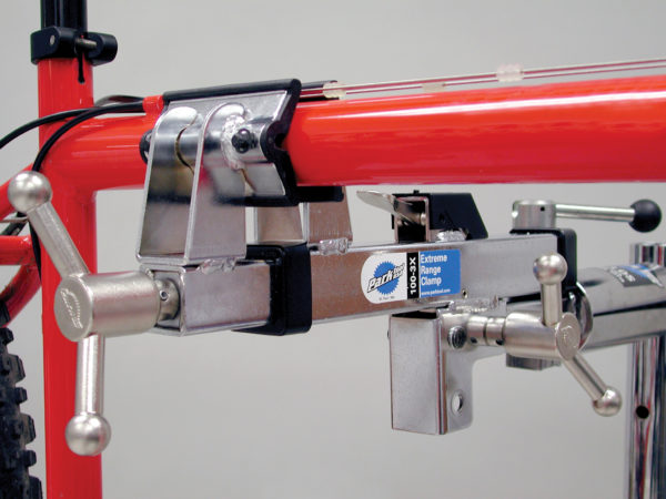 The Park Tool 100-3x Extreme Range Clamp clamping top tube of bike frame, click to enlarge