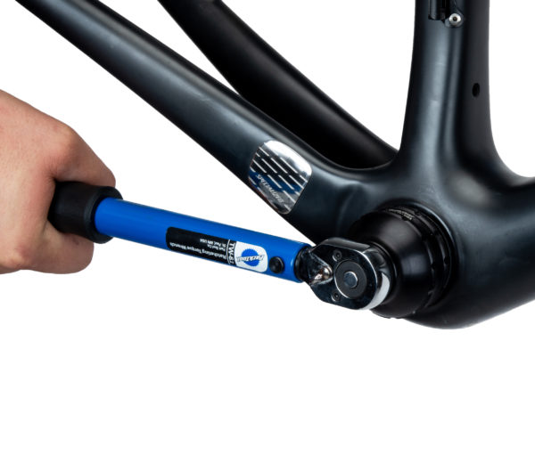 The BBT-35-12 Bottom Bracket Tool tightening an external cup on a bike frame using the TW-6.2 torque wrench, click to enlarge