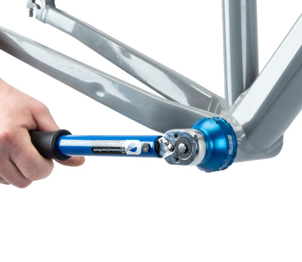 The BBT-69.3 Bottom Bracket Tool tightening an external cup on a gray MTB frame using the TW-6.2 torque wrench, click to enlarge