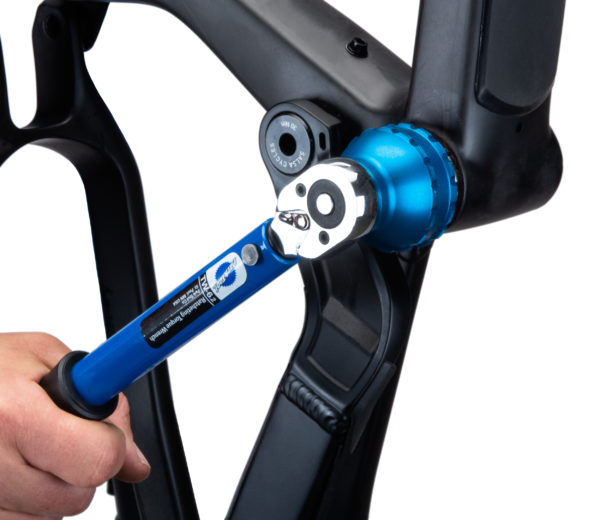 The BBT-69.4 Bottom Bracket Tool tightening an external cup on a black MTB frame using TW-6.2 torque wrench, click to enlarge