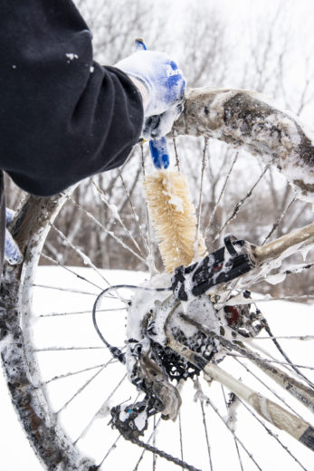BCB-5 tapered bottle brush being used to clean between spokes on soapy rear bicycle wheel., click to enlarge
