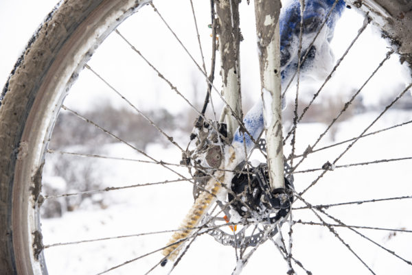 BCB-5 straight brush being used to clean between fork and hub of a dirty front bicycle wheel., click to enlarge
