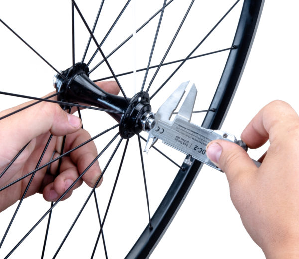 DC-2 Digital Caliper measuring the protrusion of an axle from a bicycle hub, click to enlarge