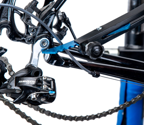 Closeup of Park Tool FAI-2 Frame Alignment Indicator pointer at the rear drive side dropout of a road bike frame, click to enlarge