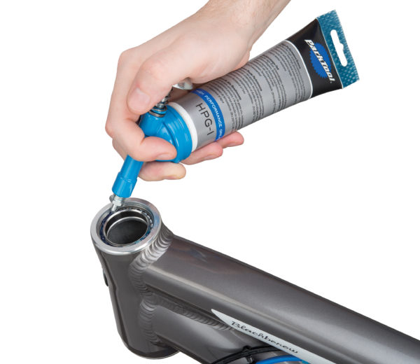 The Park Tool GG-1 Grease Gun screwed onto HPG-1 greasing headset bearings\, click to enlarge