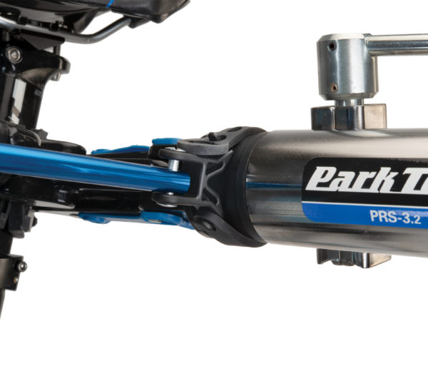 Close-up of Park Tool HBH-3 Extendable Handlebar Holder adjustable strap secured to shop repair stand clamp, click to enlarge
