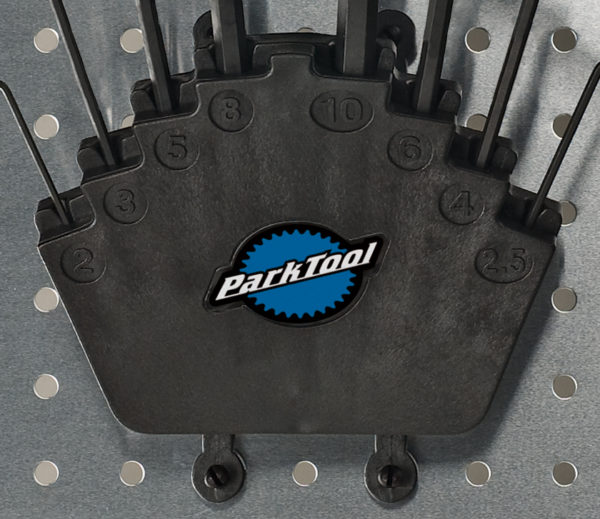 Closeup of Park Tool HXH-1 Bench Mount / Wall Mount Hex Wrench Holder mounted to metal pegboard., click to enlarge