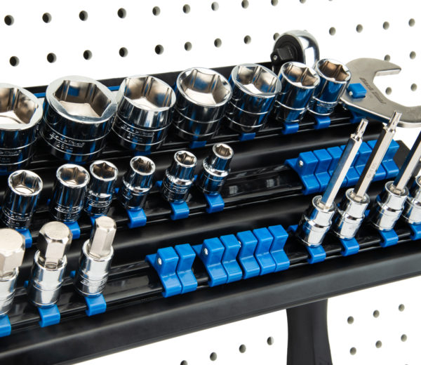 The Park Tool JH-3 Wall-Mounted Socket, Bit & Torque Tool Organizer mounted to white pegboard holding sockets, click to enlarge