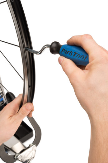The Park Tool ND-1 Nipple Driver installing nipples on wheel, click to enlarge