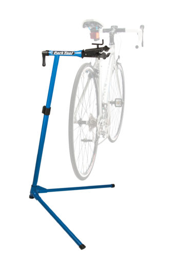 The Park Tool PCS-9 Home Mechanic Repair Stand with a ghosted image of a bicycle showing where it is clamped, click to enlarge