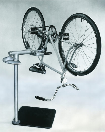The Park Tool PRS-1 Repair Stand clamped to the seat tube of a bike frame, with the bike rotated upside down., click to enlarge