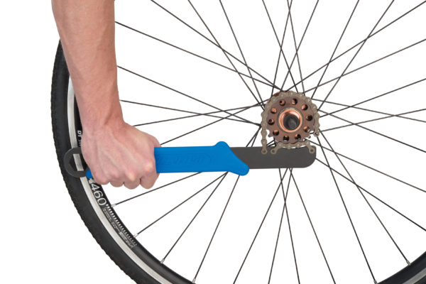The Park Tool SR-18.2 Sprocket Remover / Chain Whip removing single speed sprocket from bicycle wheel, click to enlarge
