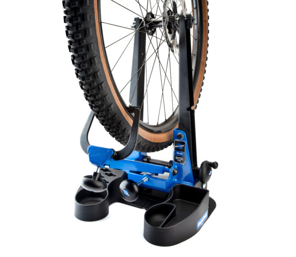 The TS-2.3 Professional Wheel Truing Stand mounted on a TSB-2.2 tilting base holding a MTB wheel with tire, click to enlarge