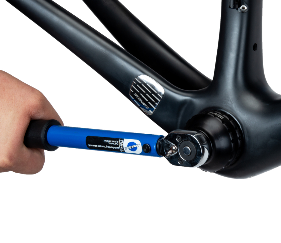 The BBT-35-36 Bottom Bracket Tool tightening an external cup on a bike frame using the TW-6.2 torque wrench, enlarged