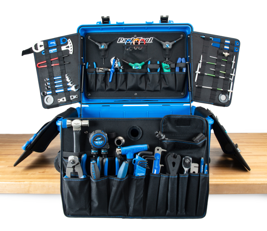 The Park Tool BRK-1 Big Rolling Kit, with all panels open and tools secured in various slots., enlarged