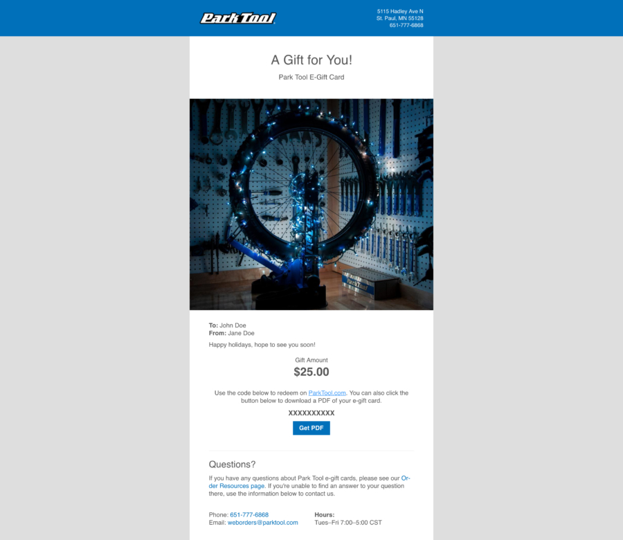 Email with a gift card for parktool.com with a photo of a bicycle wheel wrapped in blue Christmas lights, enlarged
