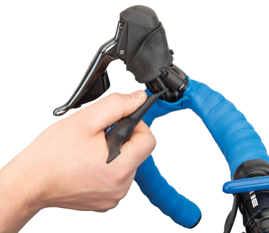 The Park Tool Bicycle Electronic Shift Tool removing E-TUBE® from Shimano® drop lever, enlarged