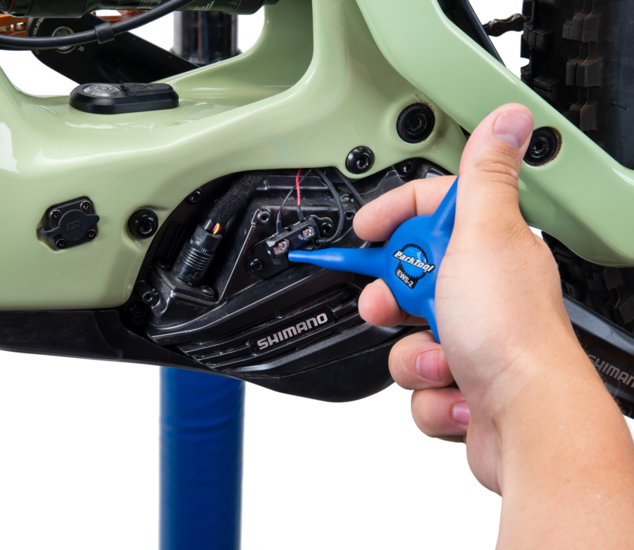 The Park Tool EWS-2 installing an E-tube® cord from a Shimano® e-bike motor, enlarged