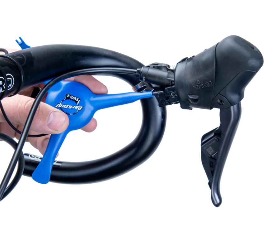The Park Tool EWS-2 removing an E-tube® cord from a Di2® shift lever, enlarged