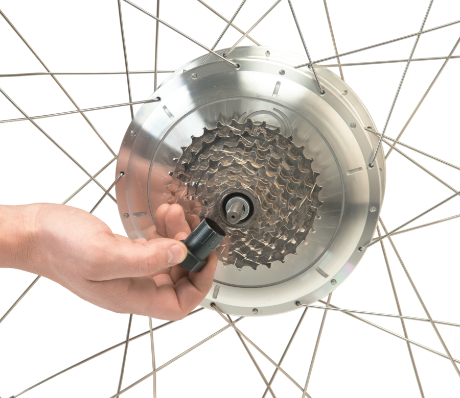 The Park Tool FR-1.3 Freewheel Remover held in front of a freewheel cassette on an electric hub motor, enlarged