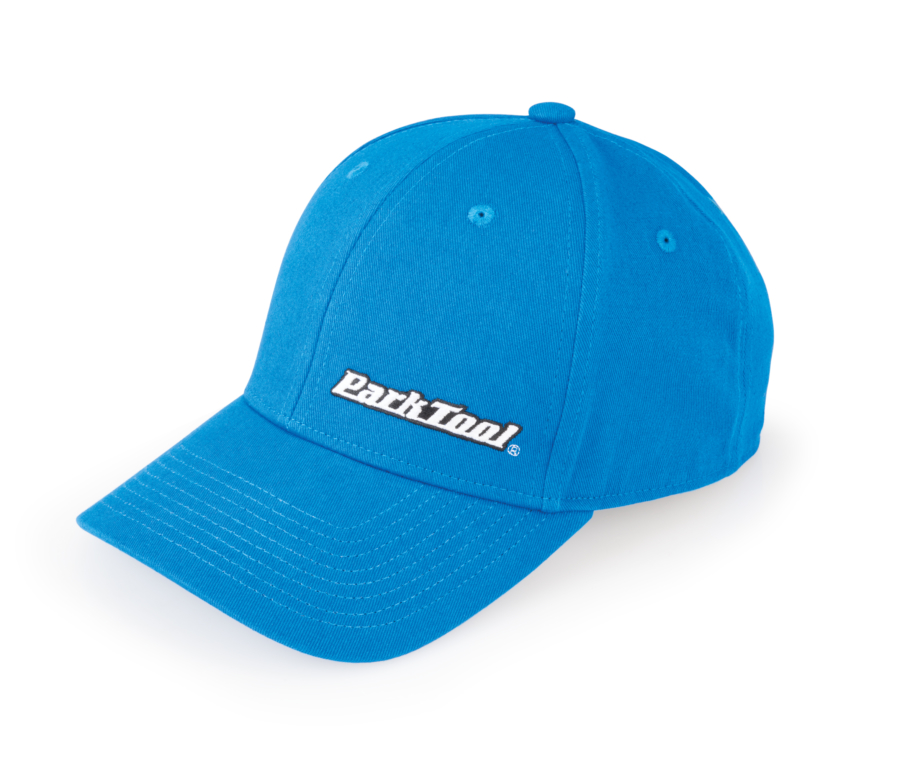 Side view of a blue baseball hat with a horizontal Park Tool logo on the lower front, enlarged