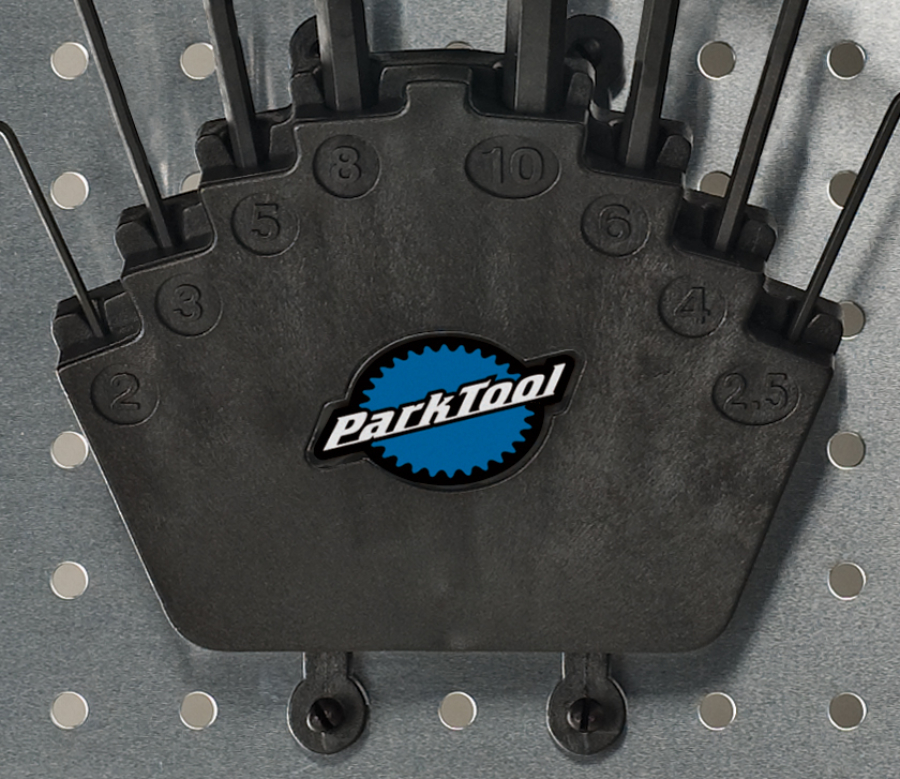 Closeup of Park Tool HXH-1 Bench Mount / Wall Mount Hex Wrench Holder mounted to metal pegboard., enlarged