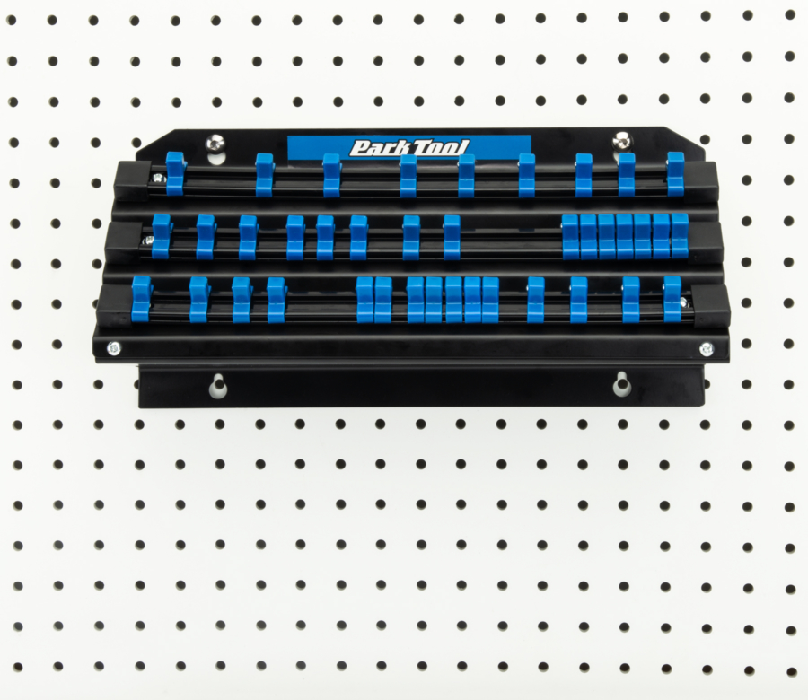 The Park Tool JH-3 Wall-Mounted Socket, Bit & Torque Tool Organizer mounted to white pegboard, enlarged