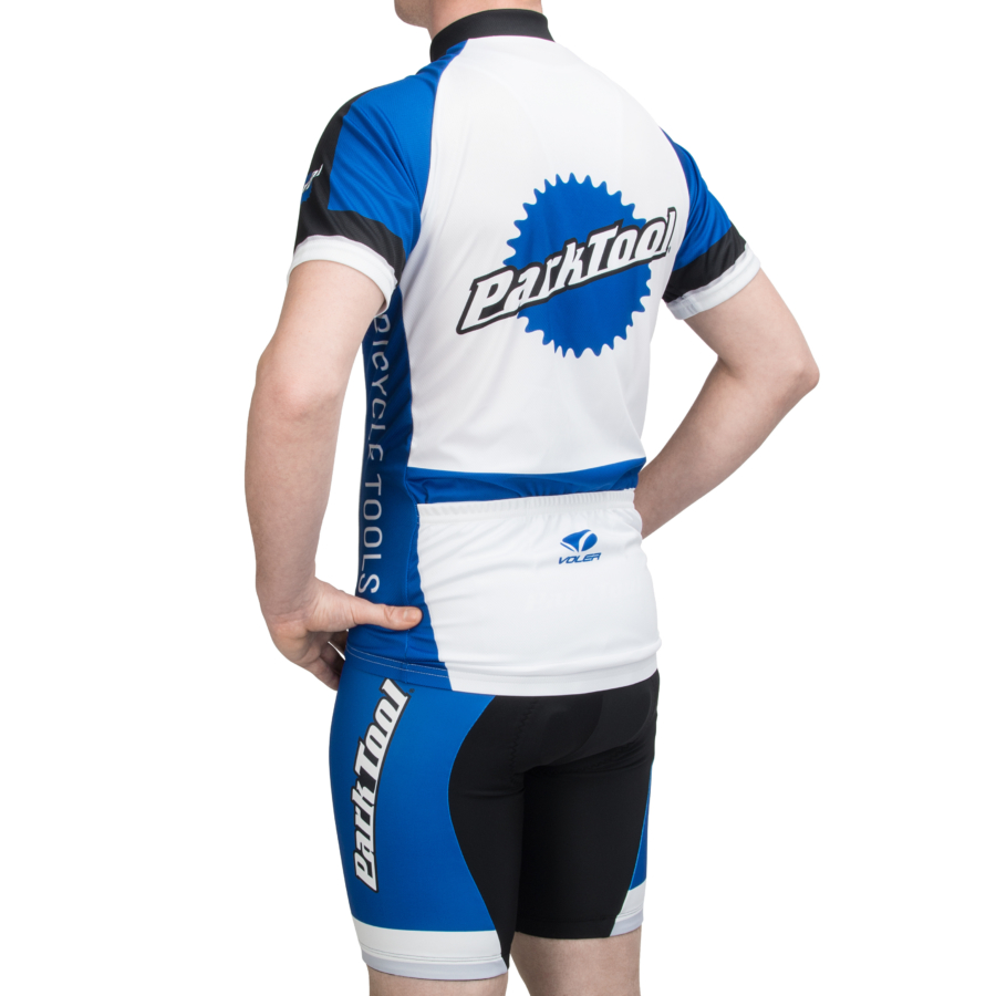 Back of model wearing Park Tool bicycle racing jersey and shorts, enlarged