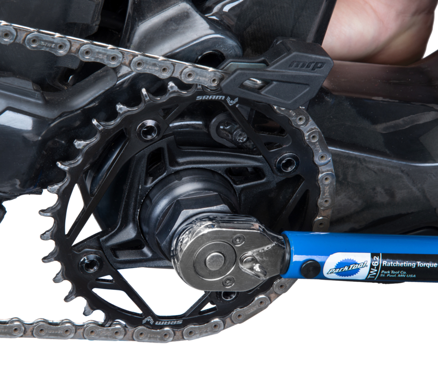 The Park Tool LRT-5 lockring tool installed on a TW-6.2 torque wrench, securing a Fazua® Ride 60 chainring lockring, enlarged
