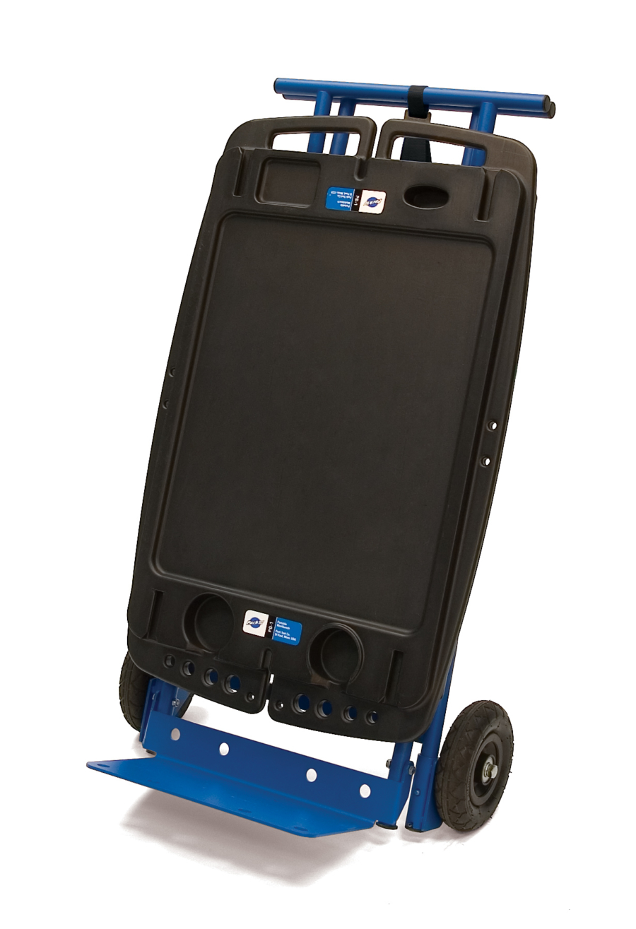The Park Tool PB-5 Two Wheel Hand Truck Kit for PB-1 Portable Workbench attached to workbench, enlarged