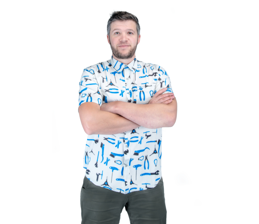 The Park Tool PRT-1 Party Shirt worn by a male model with arms crossed, enlarged