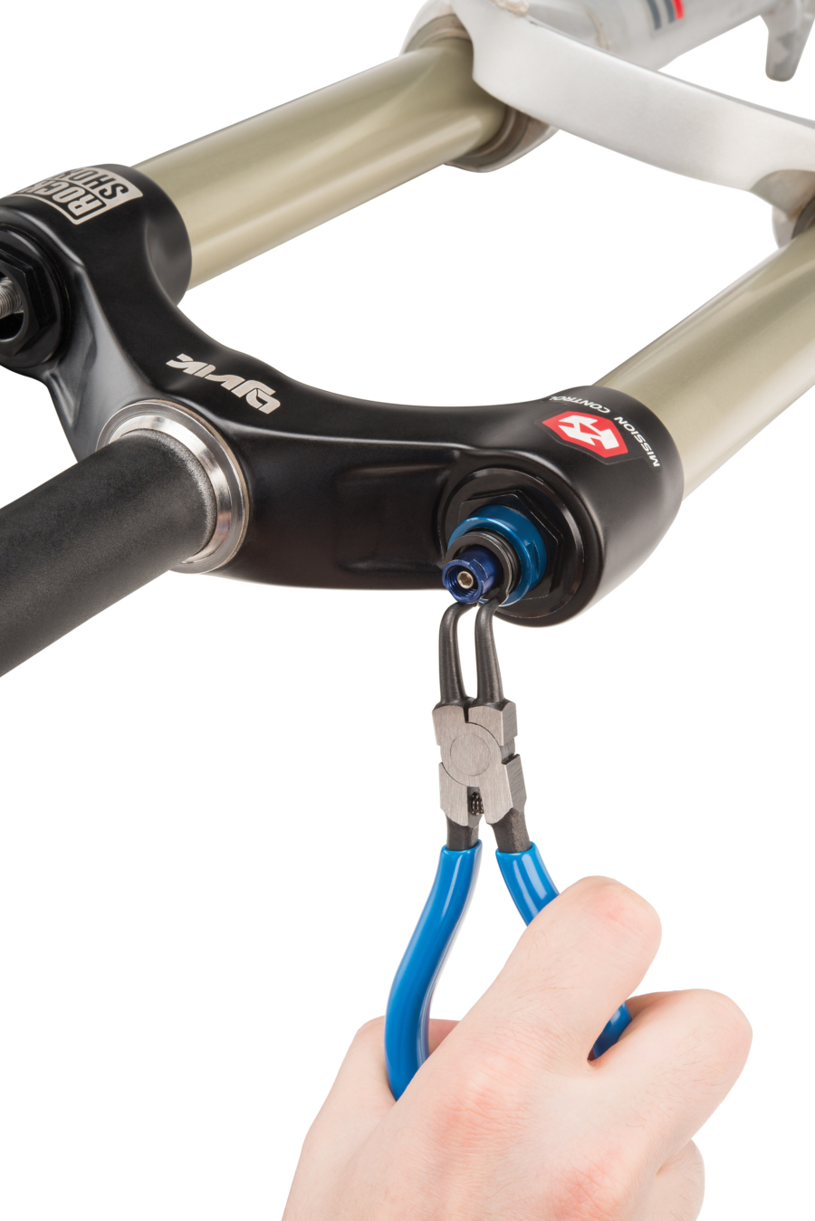 The Park Tool RP-2 1.3mm Internal Retaining Ring Pliers removing lockring from RockShox® lockout, enlarged