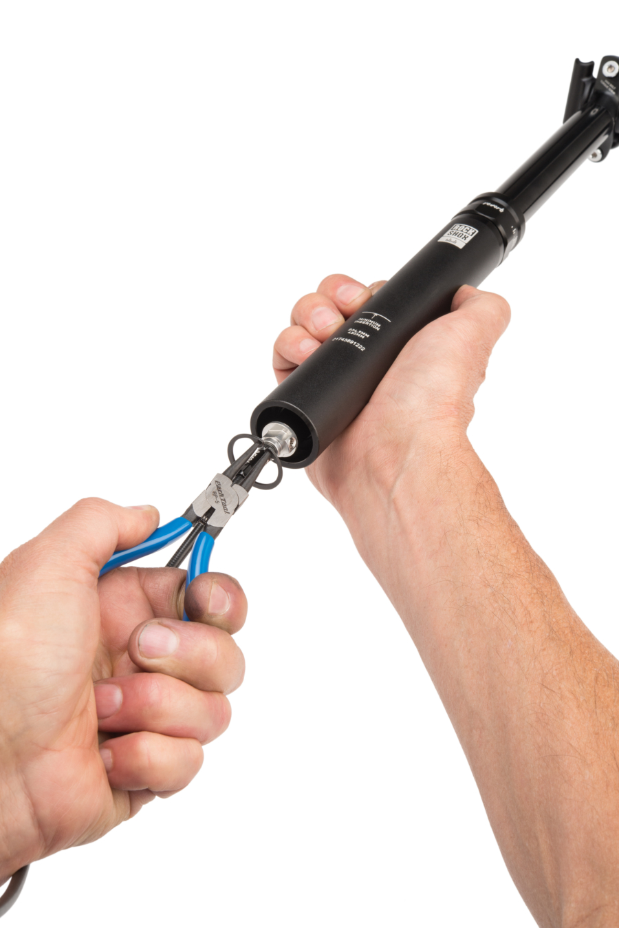 The Park Tool RP-5 1.7mm Internal Retaining Ring Pliers removing lockring from RockShox® Reverb™, enlarged