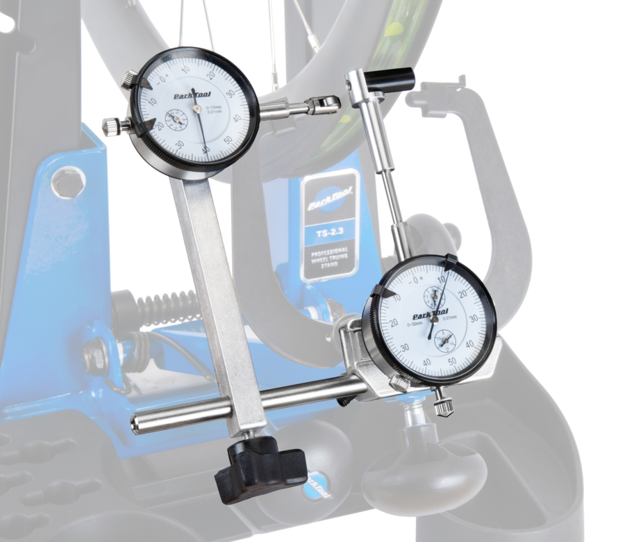 The Park Tool TS-2Di Dial Indicator Gauge Set mounted to a TS-2.3 truing stand., enlarged