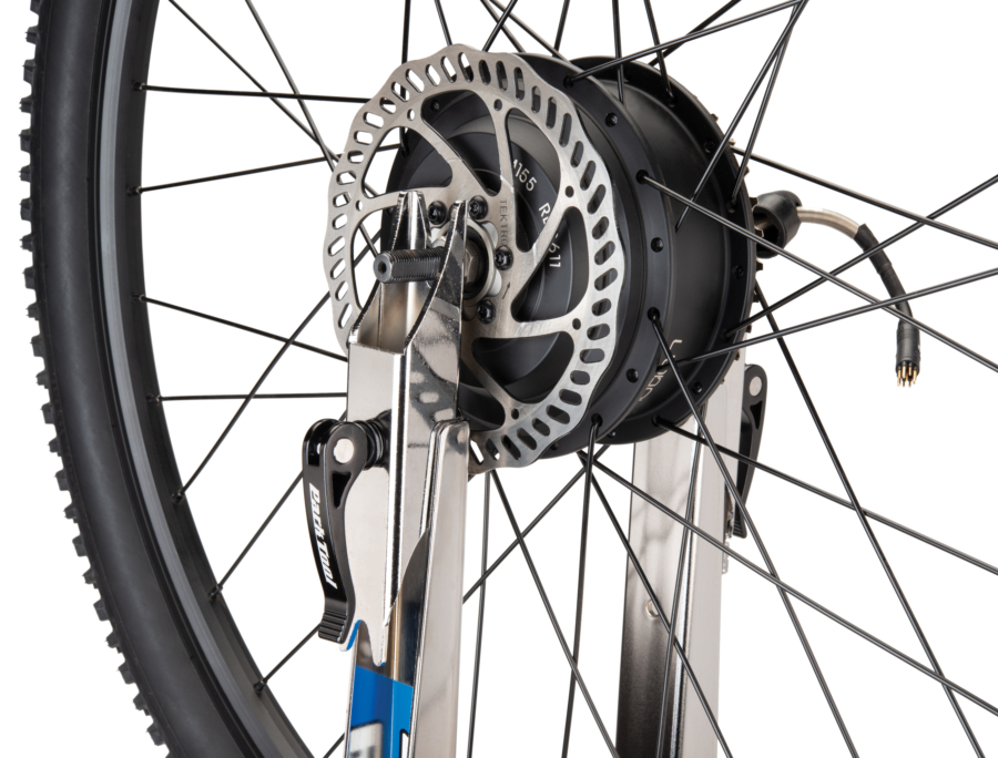 Close-up of Park Tool TS-2EXT.3 Truing Stand Extensions / Adaptors holding rear drive e-bike wheel, enlarged