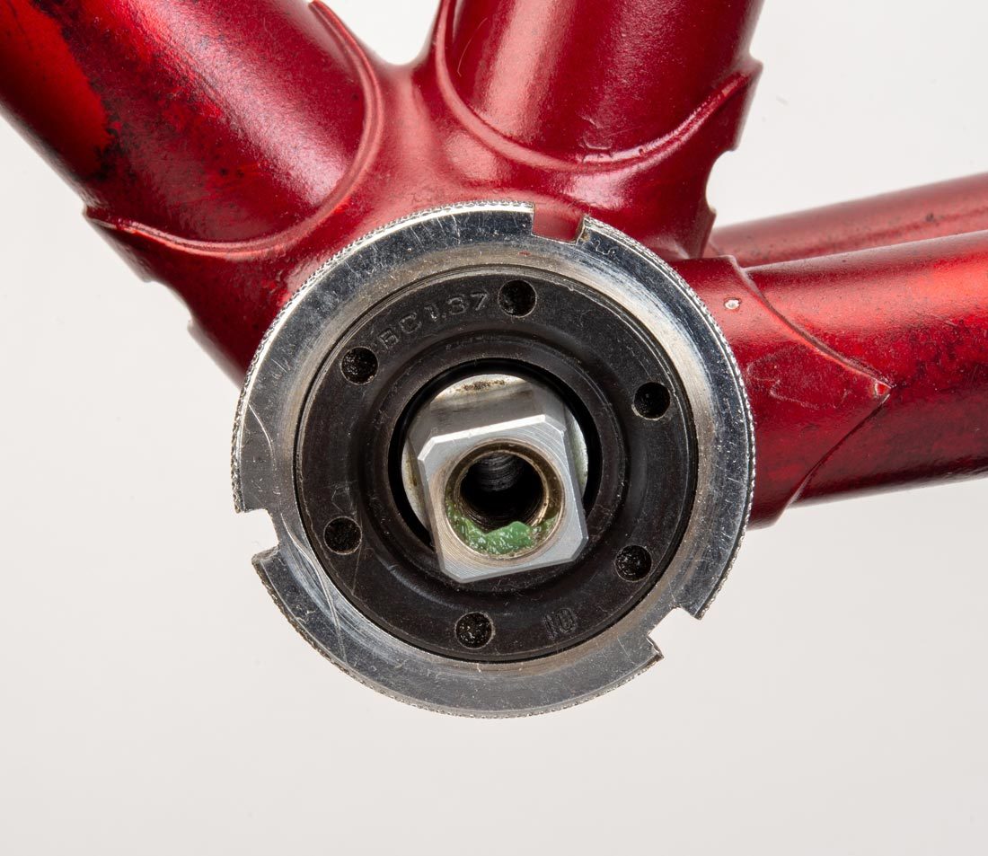 Bottom bracket cup with 6 pin holes, installed in bottom bracket shell