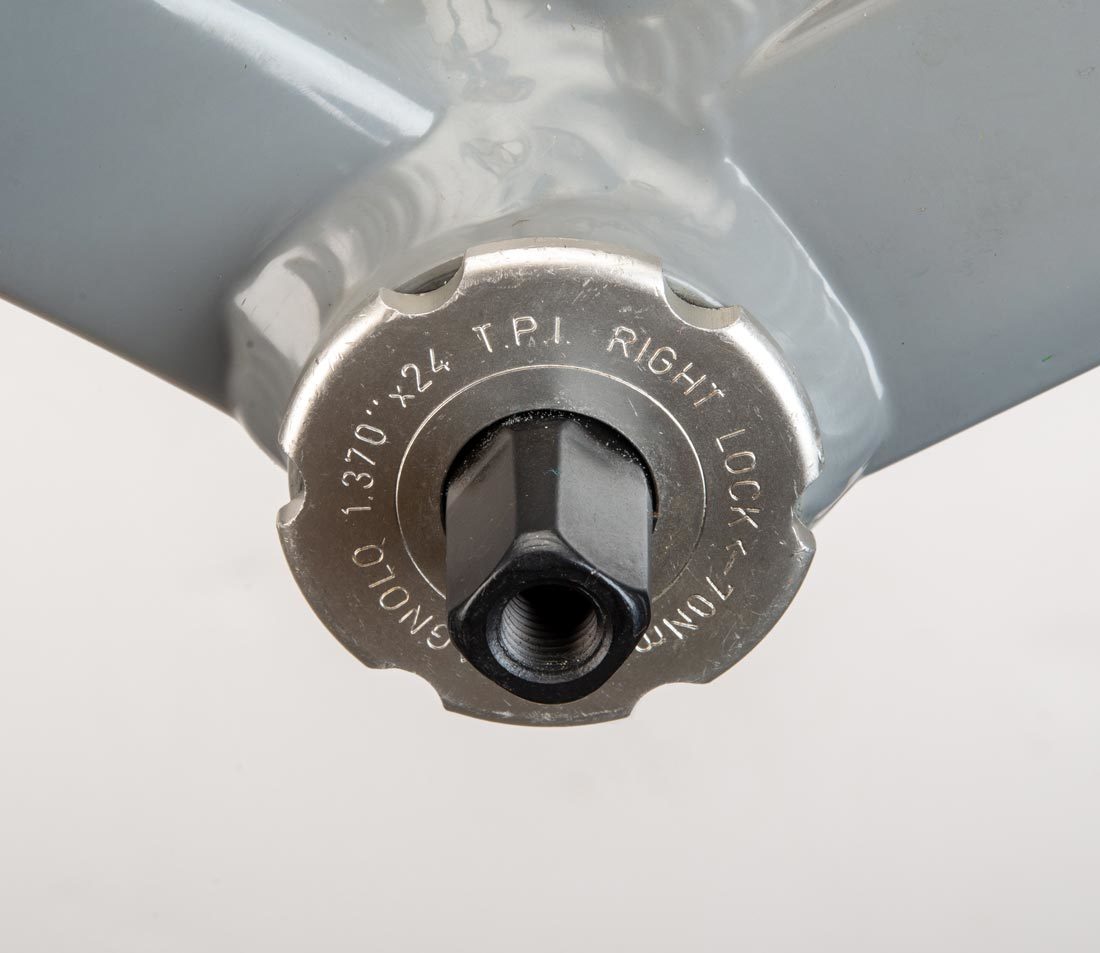 Cartridge bottom bracket with 6 external notches, installed in bottom bracket shell of gray alloy bike frame