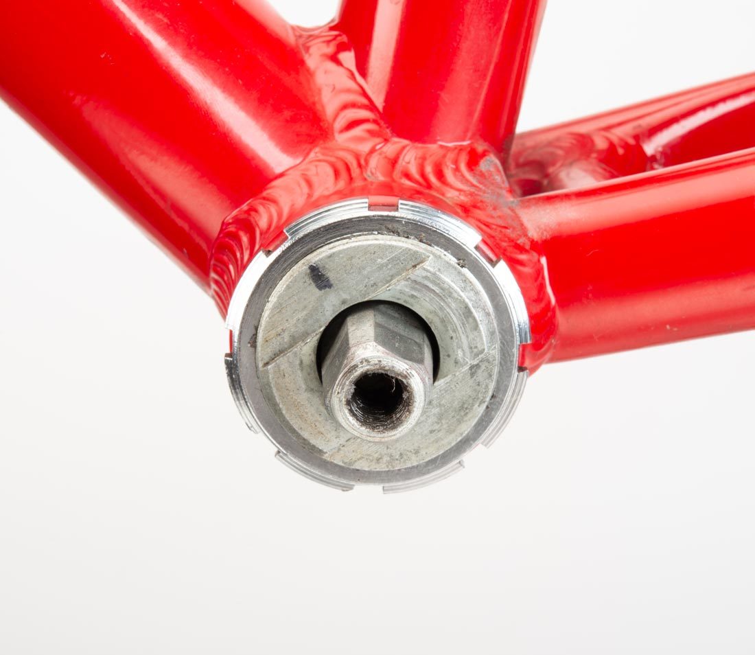 Closeup of bottom bracket up with two wrench flats, installed in bottom bracket shell