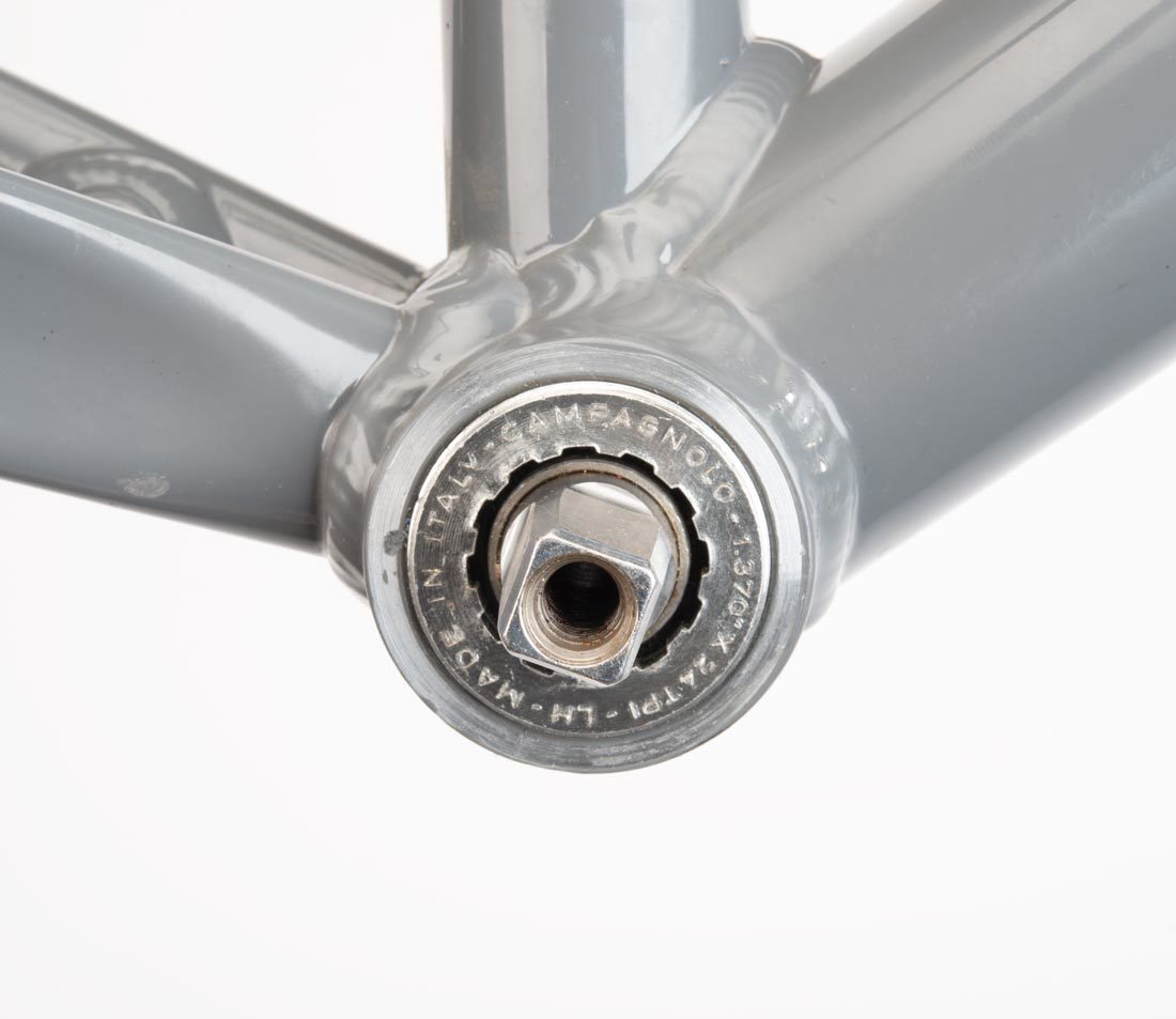 Cartridge bottom bracket with 12 internal splines, installed in bottom bracket shell on gray alloy bike frame