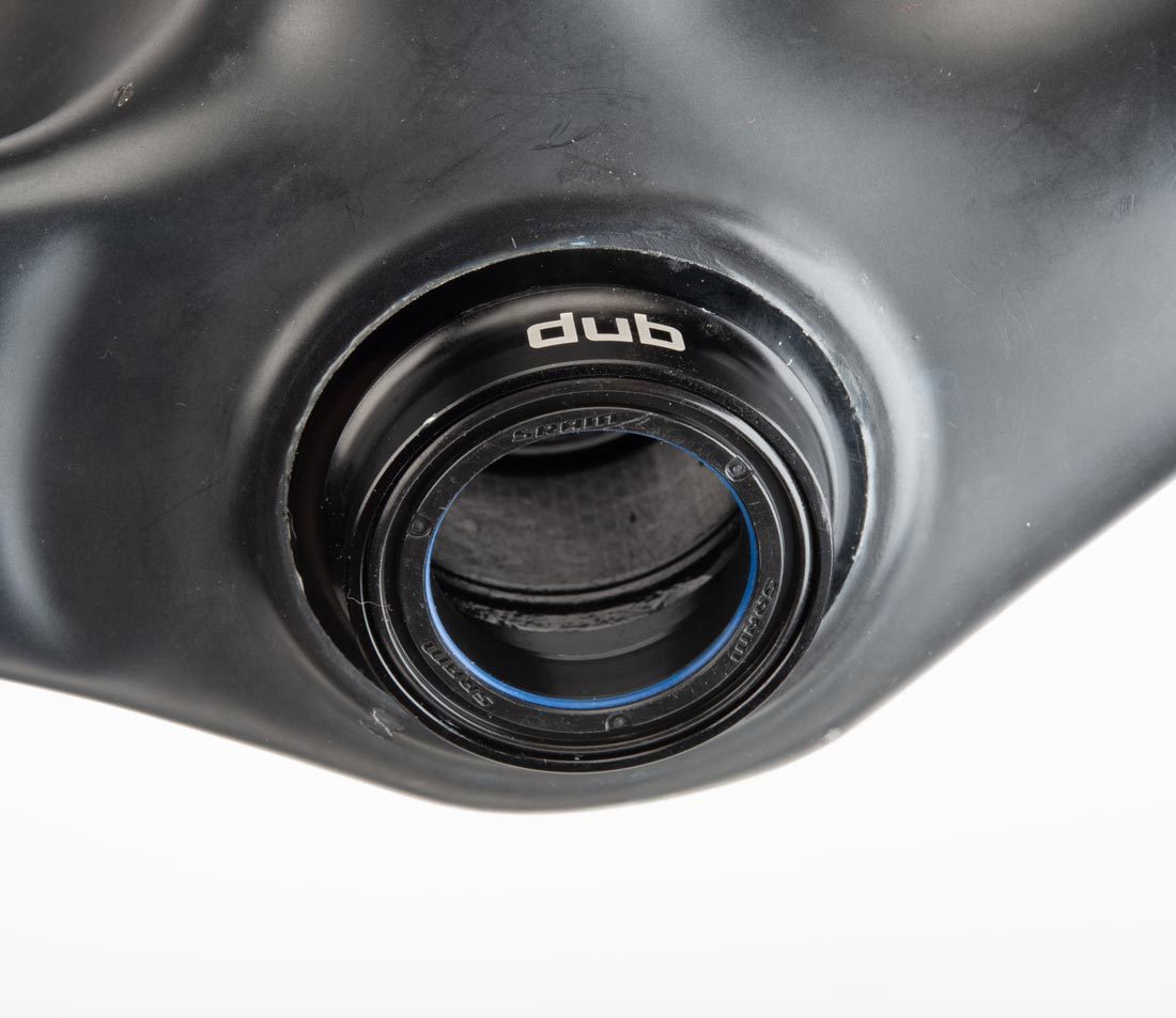 Press fit bottom bracket adaptor installed in bottom bracket shell of carbon fiber bicycle frame