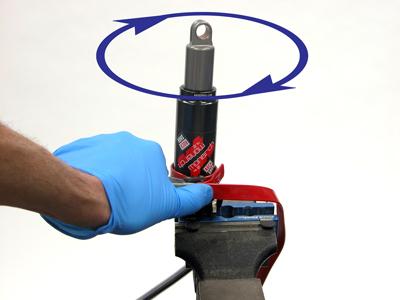 Figure 23. Tighten air-can fully using a strap wrench