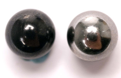 Ceramic 1/4-inch ball on left and a 1/4-inch steel ball on right.