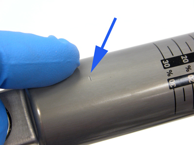 Figure 17. Inspect for damage to shock damper. This mark is beyond the travel of the seal, and is not a problem.