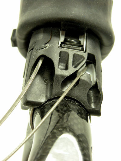 The thinner shift wire is routed from the inner groove option. The thicker brake wire is routed from the brake hole.